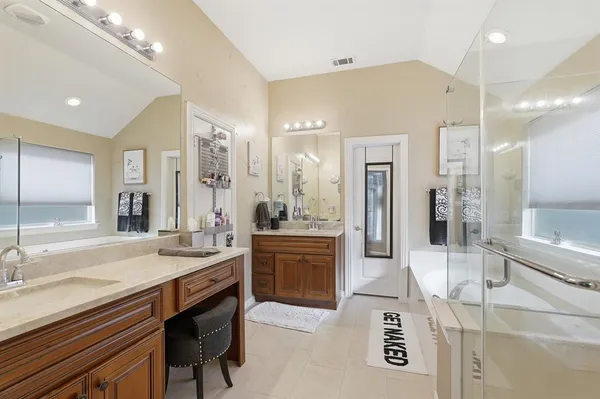 a white bath tub sitting next to a shower