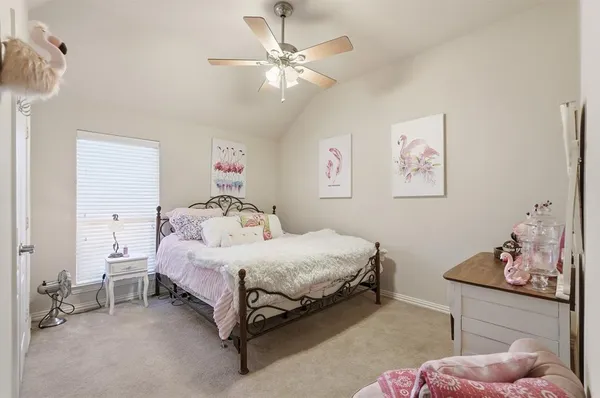 a bedroom with furniture and a gym equipment