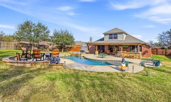 a view of a house with swimming pool and porch