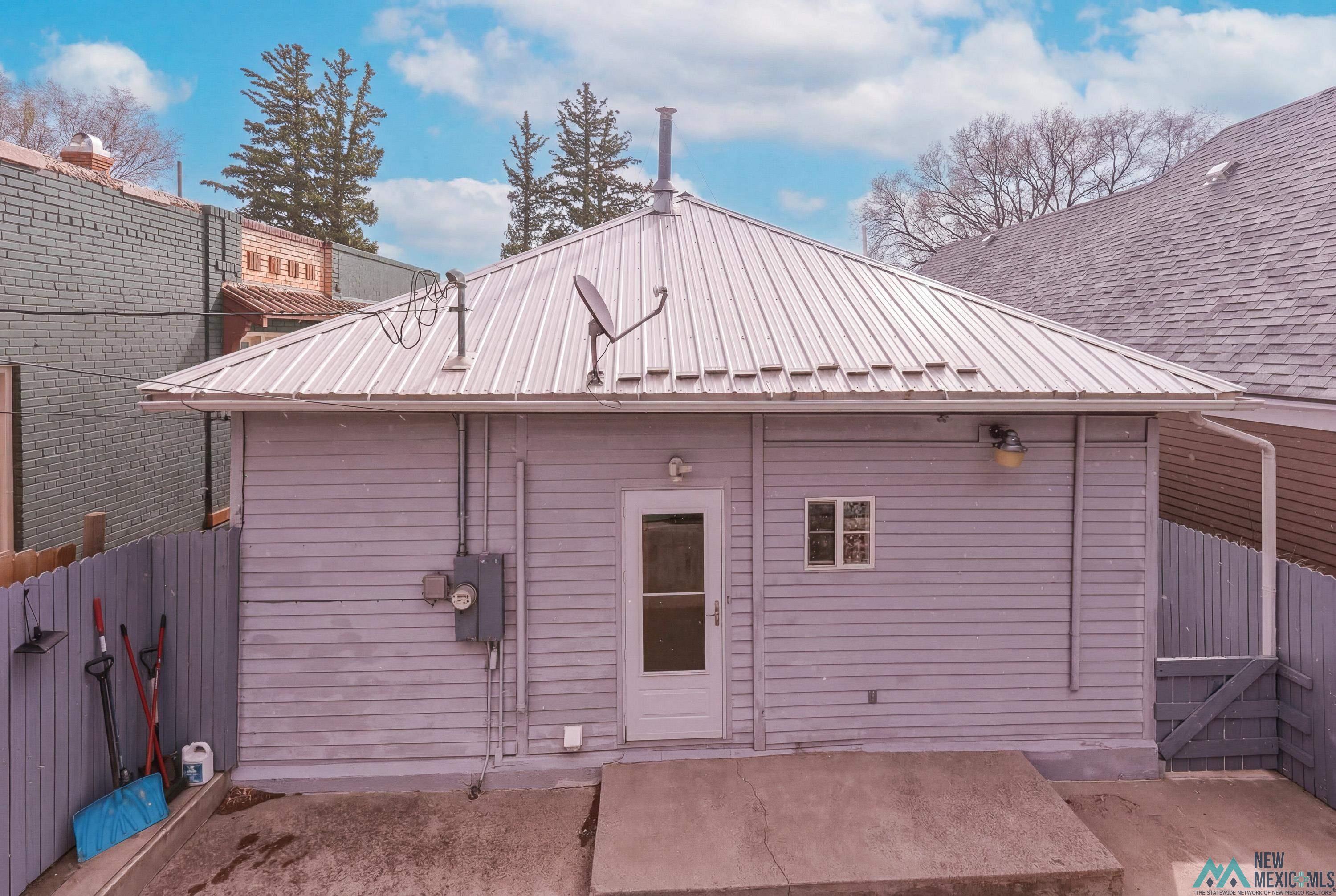 120 South 5th Street Raton, NM 87740 - Photo 20 of 25 Back of property with a metal roof