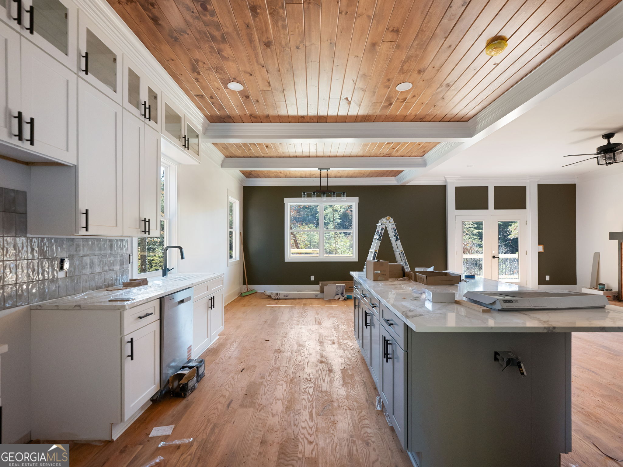 150 Alte Bruecke Strasse Helen, GA 30545 - Photo 12 of 43 a kitchen with kitchen island granite countertop a sink stove and wooden cabinets