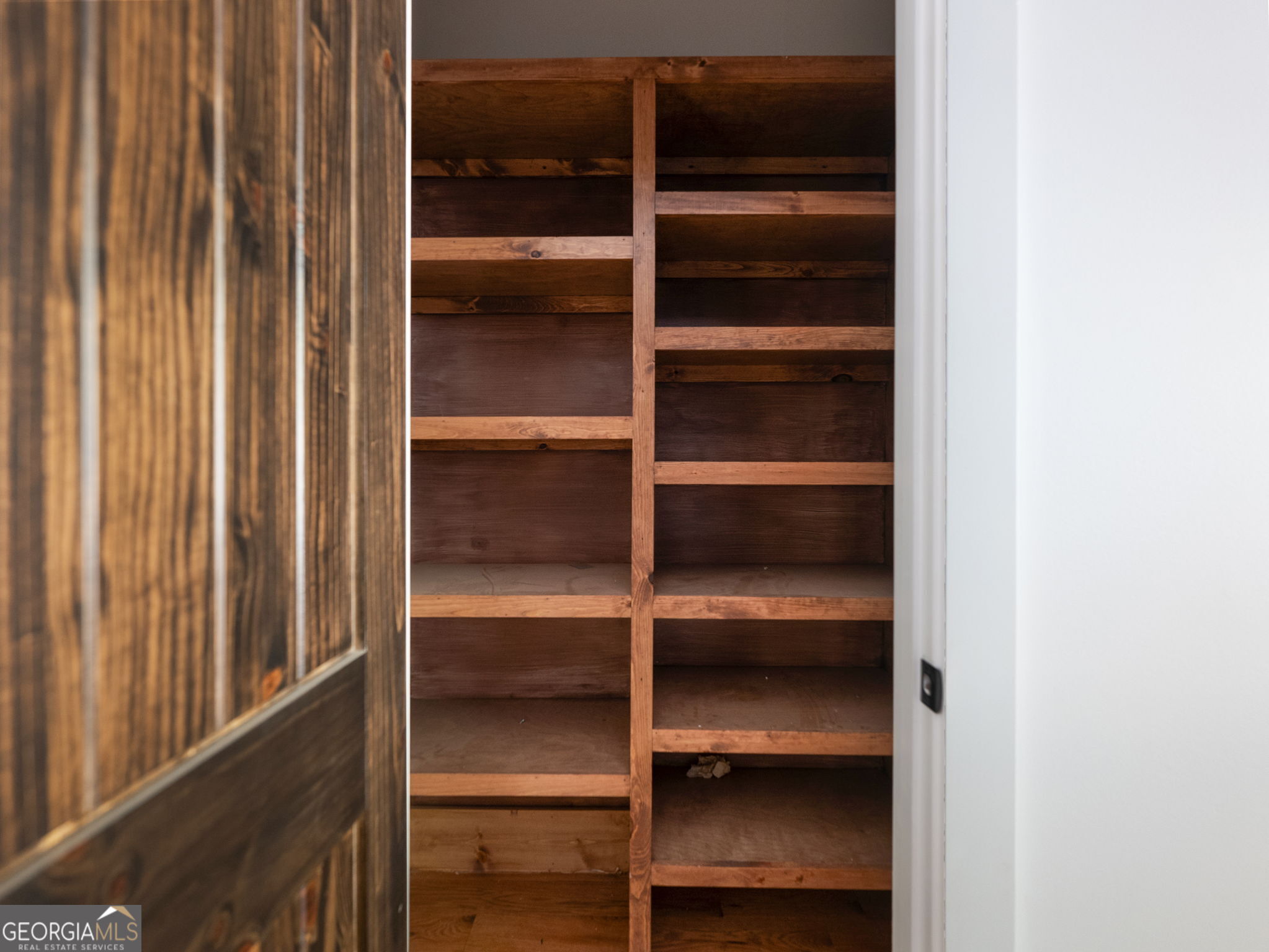 150 Alte Bruecke Strasse Helen, GA 30545 - Photo 21 of 43 a view of walk in closet with empty racks