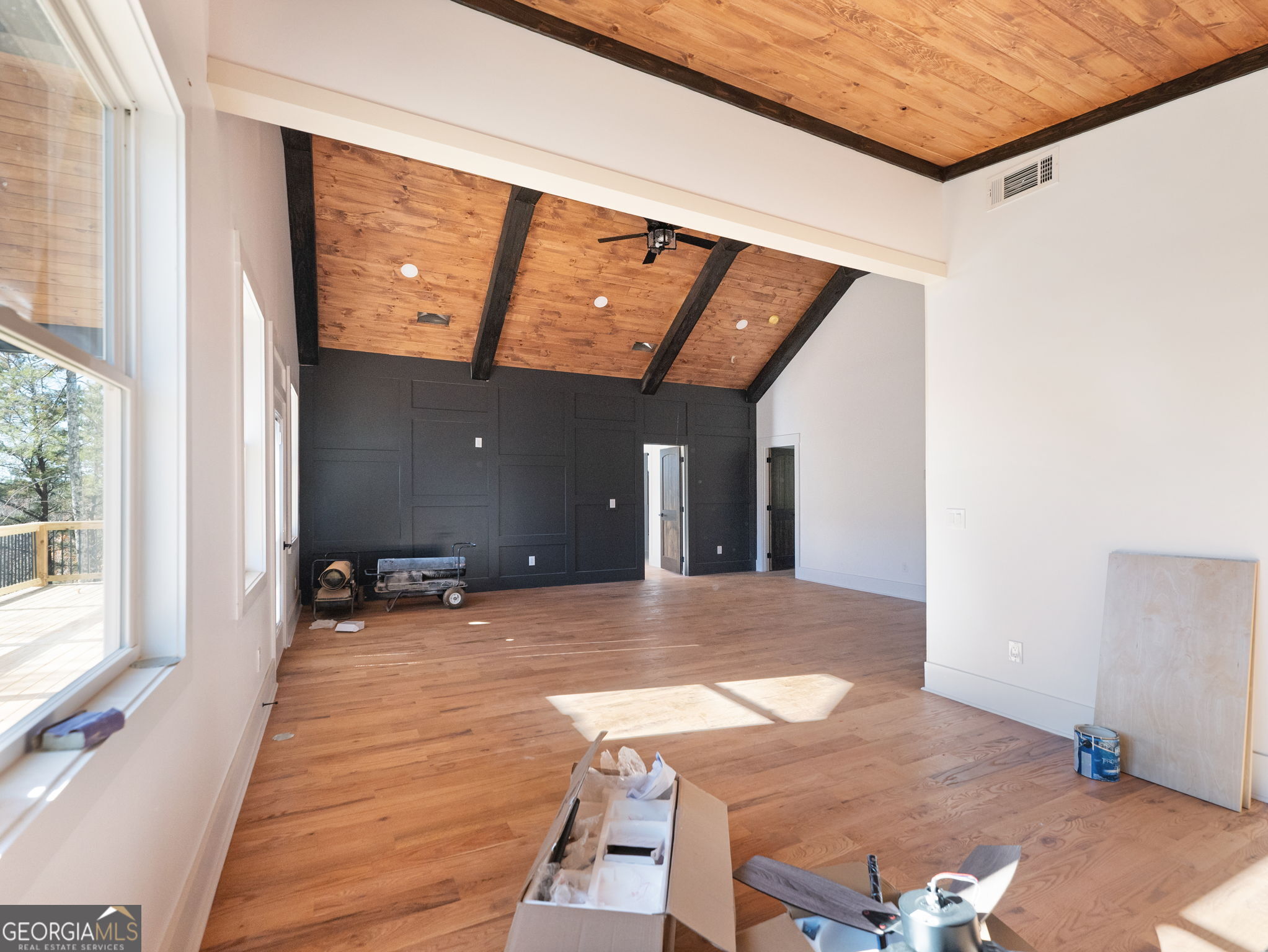 150 Alte Bruecke Strasse Helen, GA 30545 - Photo 25 of 43 a view of a living room with a balcony wooden floor and a ceiling fan