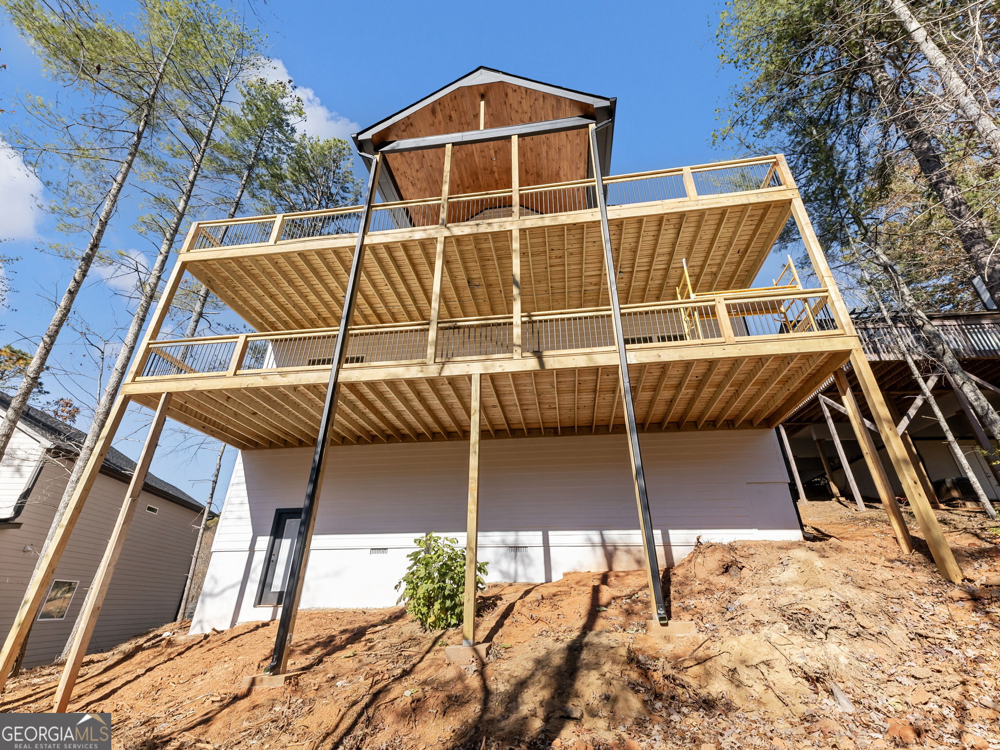 150 Alte Bruecke Strasse Helen, GA 30545 - Photo 38 of 43 a view of a patio with table and chairs with wooden floor and fence and a barbeque