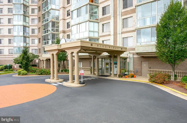 a view of a building with sitting area