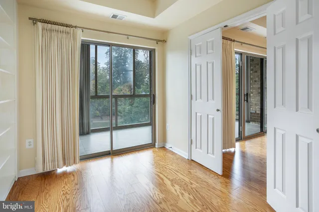a view of gallery with wooden floor