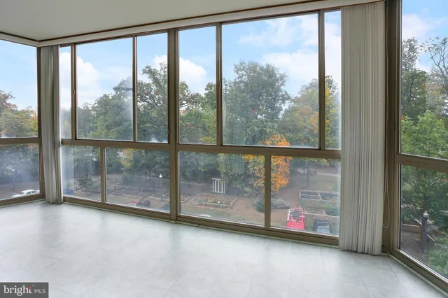 a view of parking garage with cars parked