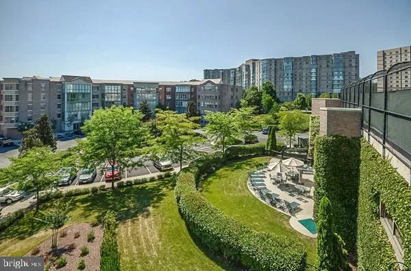 a view of a dining room with furniture and a kitchen