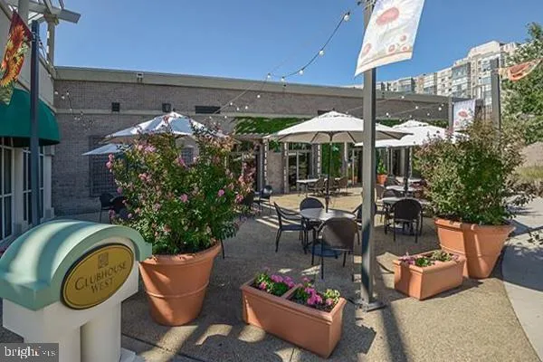 a living room with lots of furniture and a chandelier