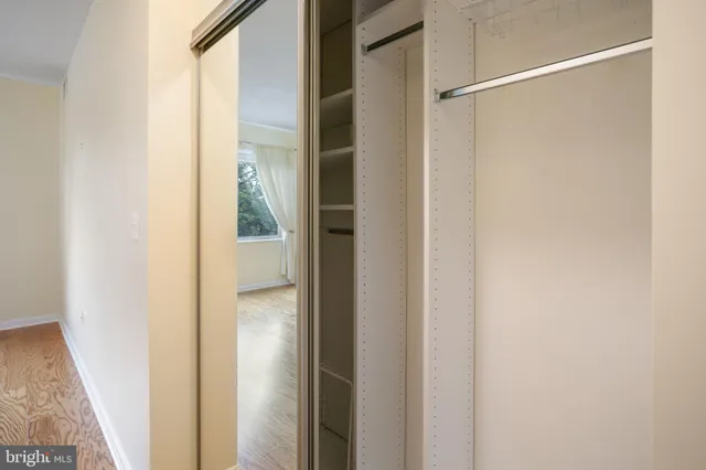 a bathroom with a sink toilet and a mirror