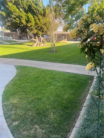 a view of a swimming pool and a yard