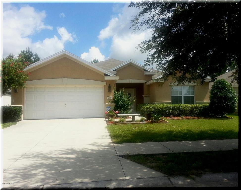 5625 Southwest 39th Street Ocala, FL 34474 - Photo 1 of 1 a front view of a house with a yard