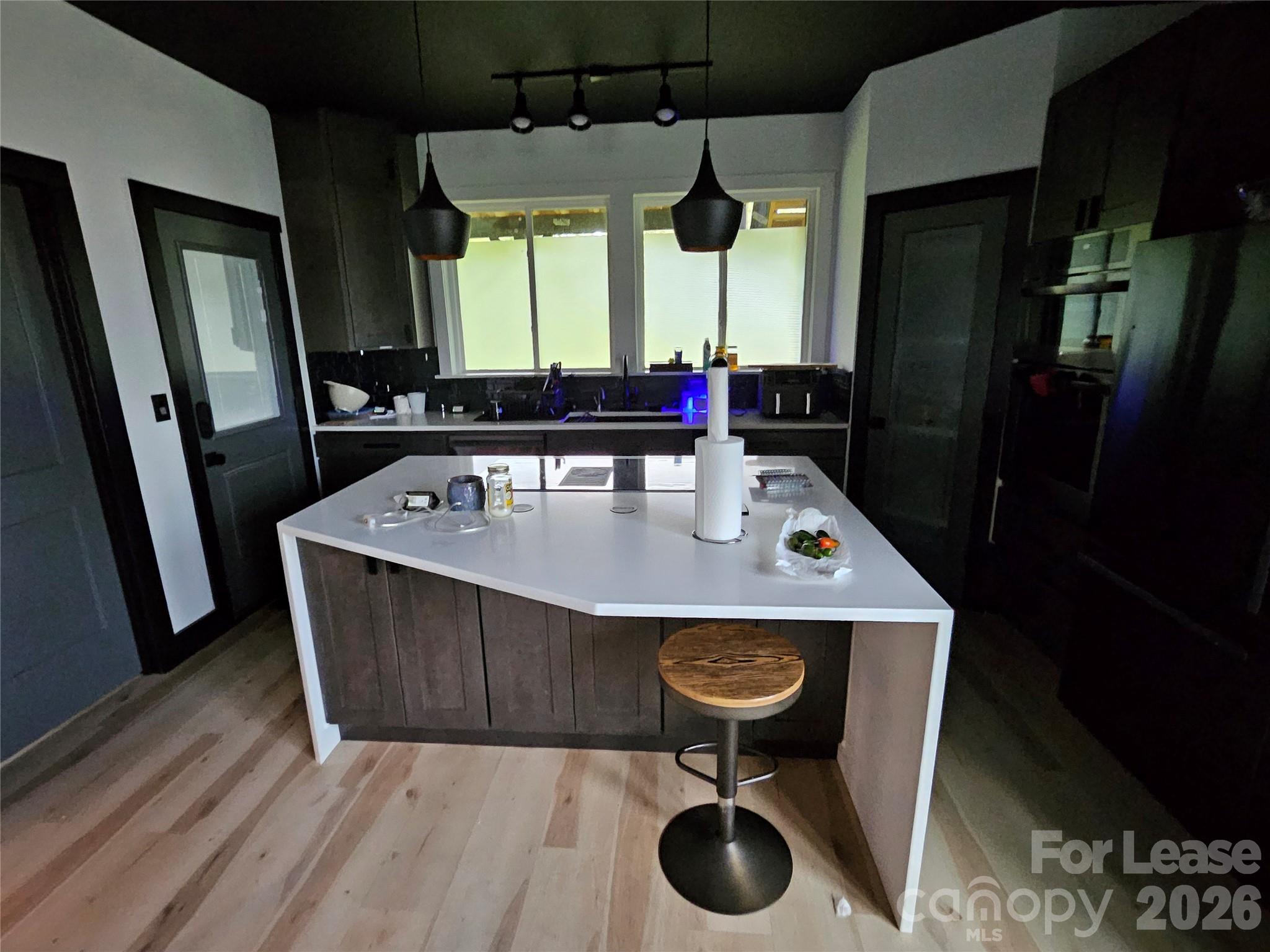 1002 Crawford Road, Unit 6 Rock Hill, SC 29730 - Photo 13 of 17 a kitchen with sink a refrigerator and chairs