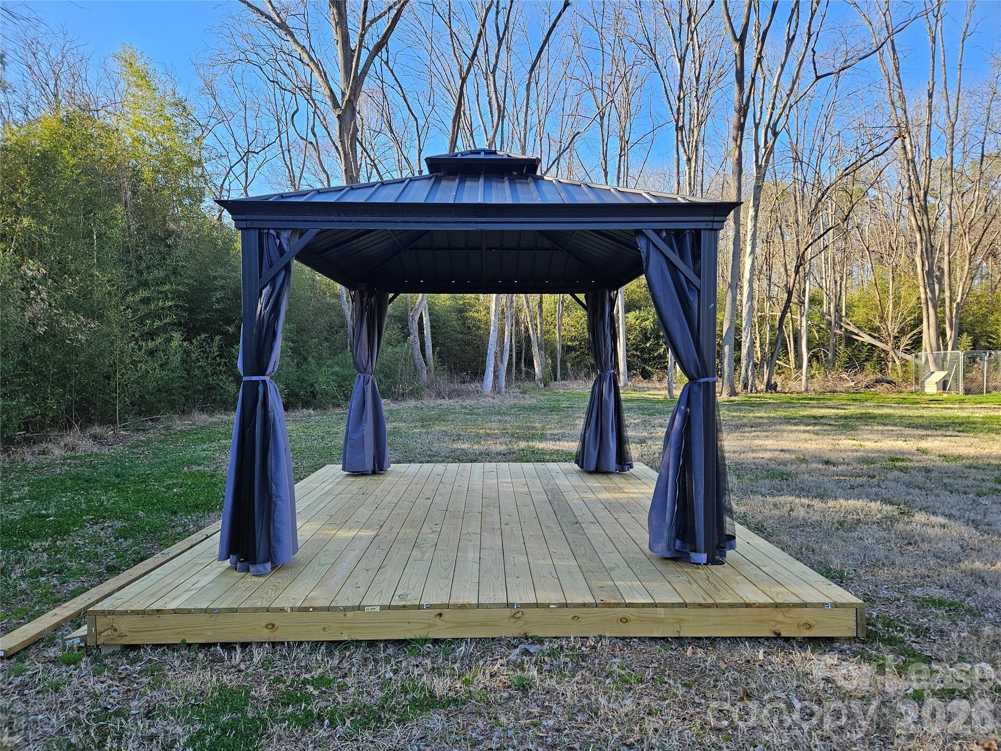 1002 Crawford Road, Unit 6 Rock Hill, SC 29730 - Photo 17 of 17 a wooden bench sitting in middle of a yard