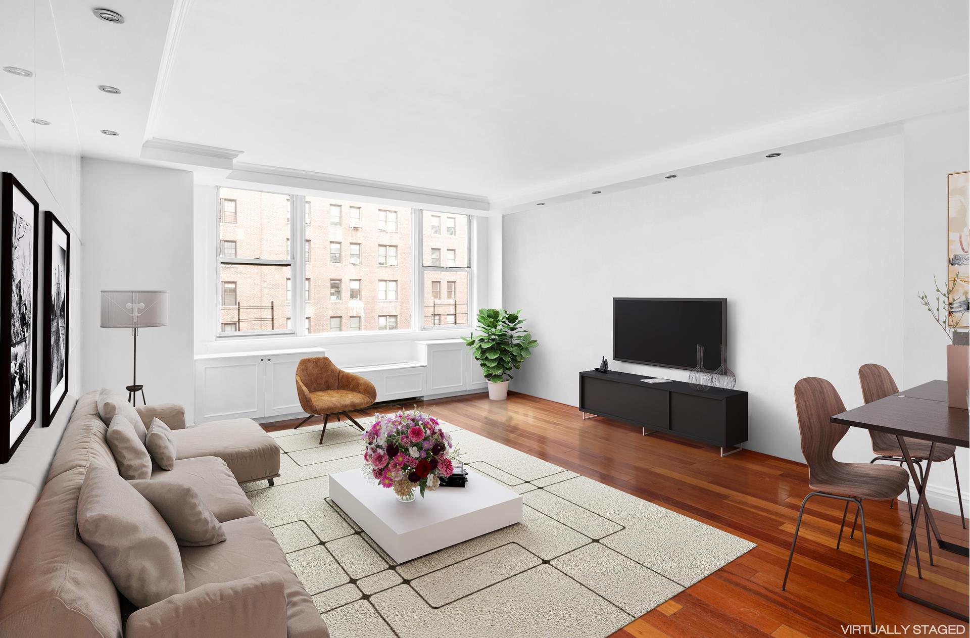 200 West 79th Street, Unit 10GH Manhattan, NY 10024 - Photo 1 of 19 a living room with furniture a rug and a flat screen tv