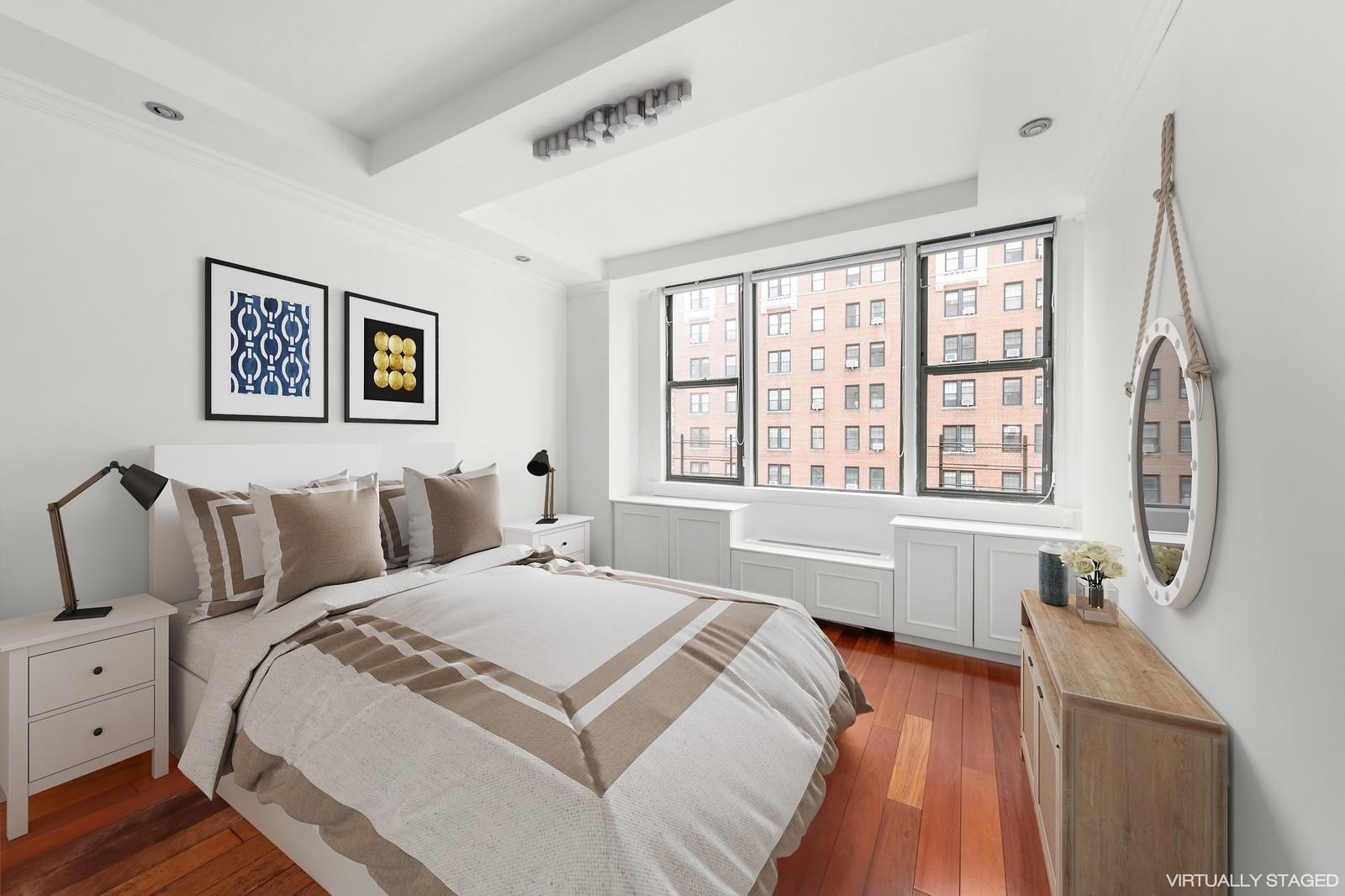 200 West 79th Street, Unit 10GH Manhattan, NY 10024 - Photo 10 of 19 a spacious bedroom with a bed and a large window