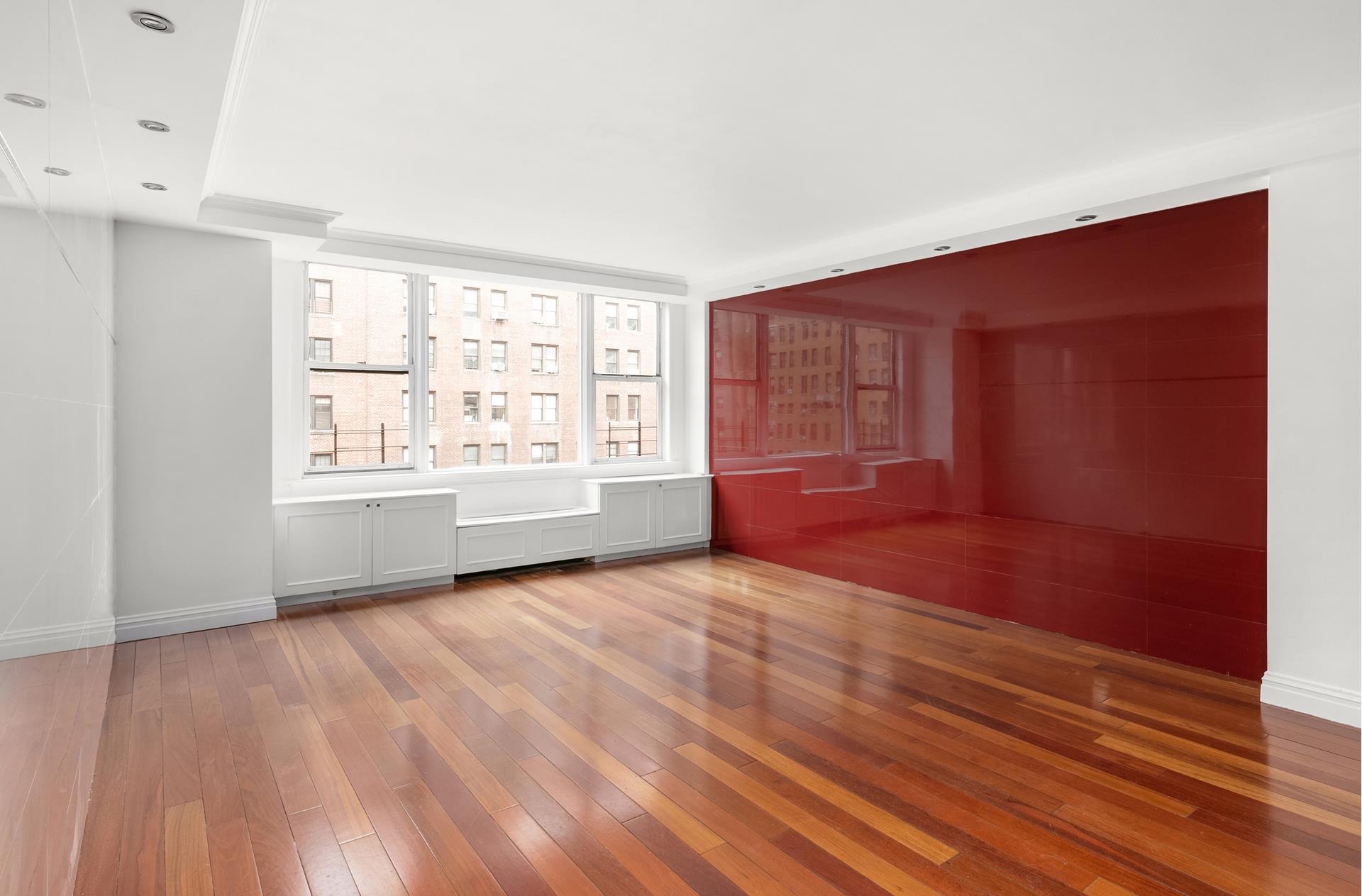 200 West 79th Street, Unit 10GH Manhattan, NY 10024 - Photo 2 of 19 a view of an empty room with wooden floor and a window