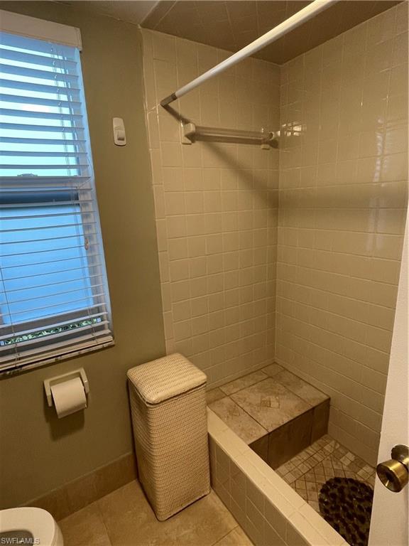 541 Teryl Road, Unit 1 Naples, FL 34112 - Photo 19 of 33 a bathroom with a sink toilet and shower