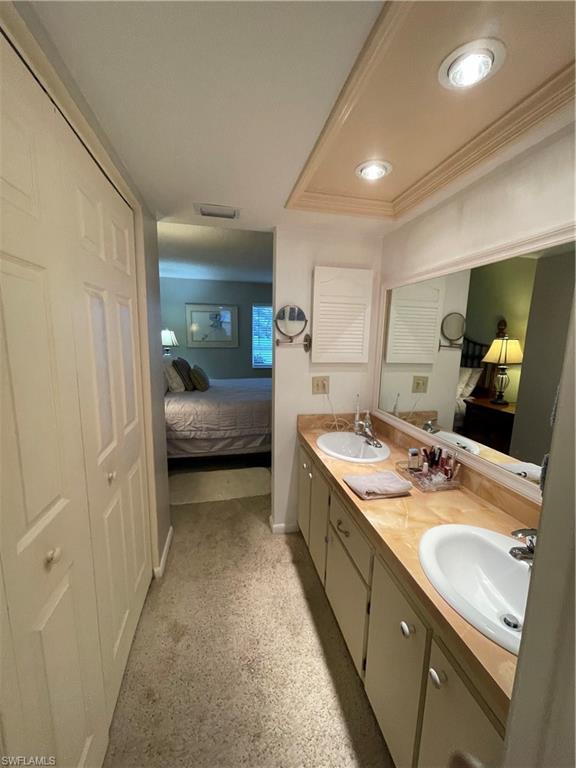 541 Teryl Road, Unit 1 Naples, FL 34112 - Photo 21 of 33 a bathroom with a sink double vanity and a mirror
