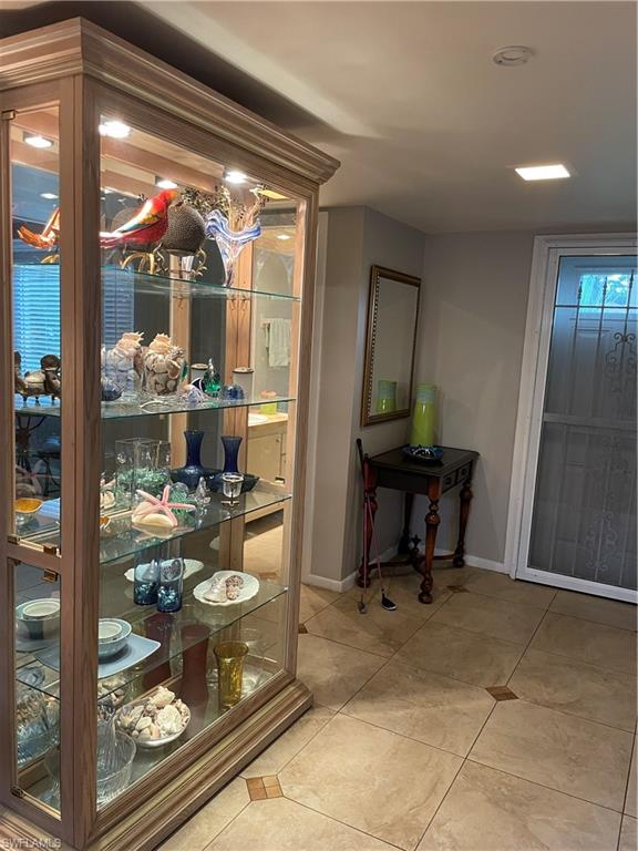 541 Teryl Road, Unit 1 Naples, FL 34112 - Photo 22 of 33 a room with furniture and a mirror