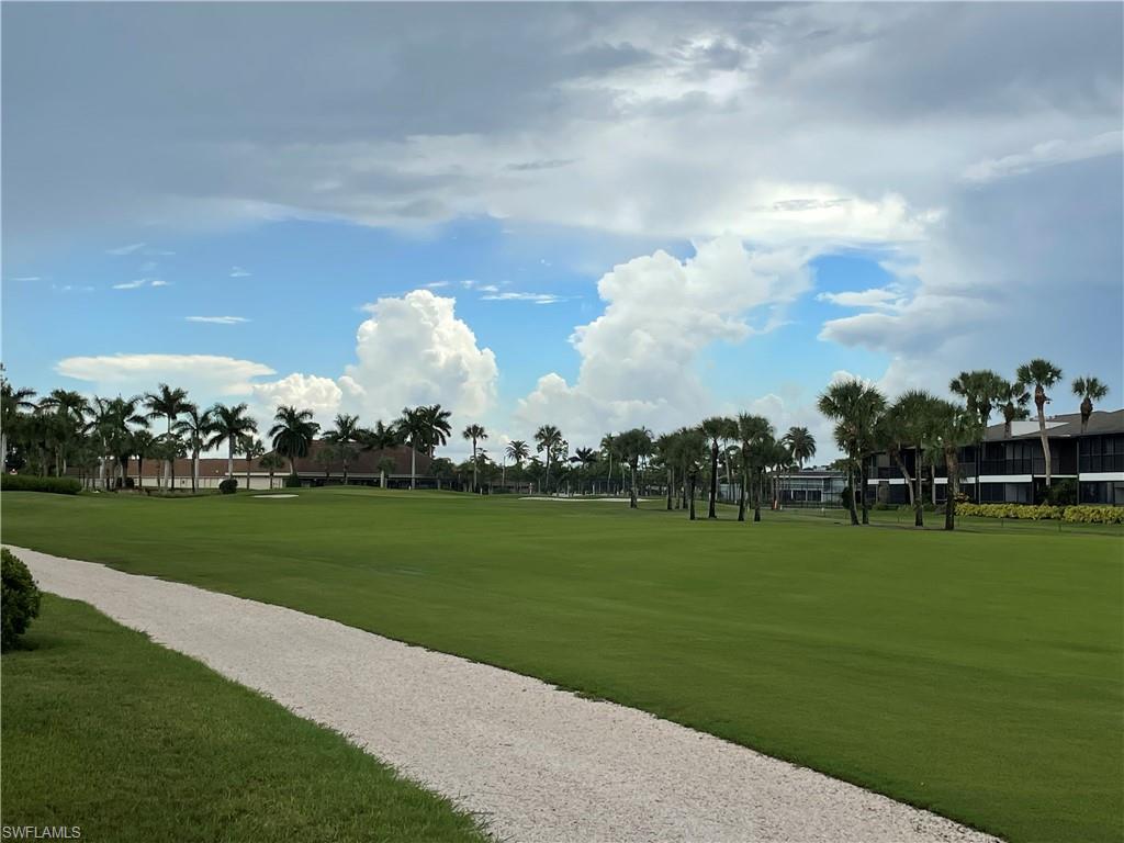 541 Teryl Road, Unit 1 Naples, FL 34112 - Photo 30 of 33 a view of a golf course with huge green field and trees