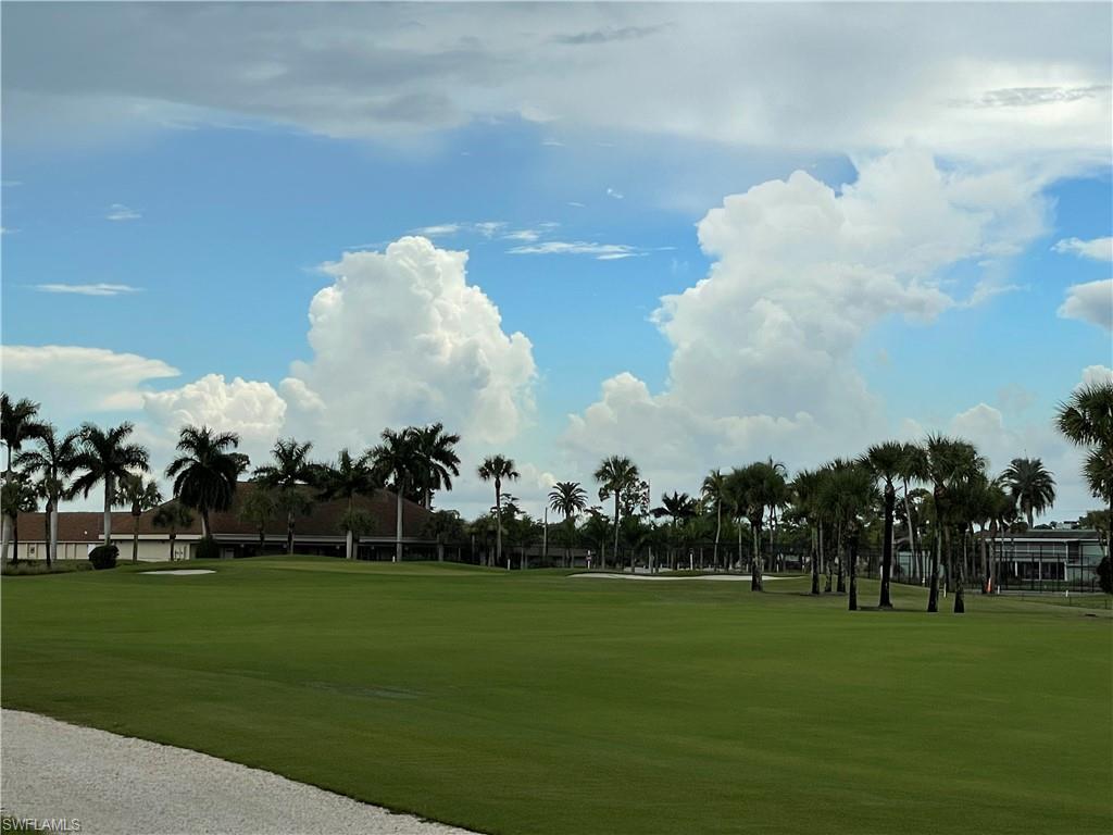 541 Teryl Road, Unit 1 Naples, FL 34112 - Photo 31 of 33 a view of building with outdoor space and garden