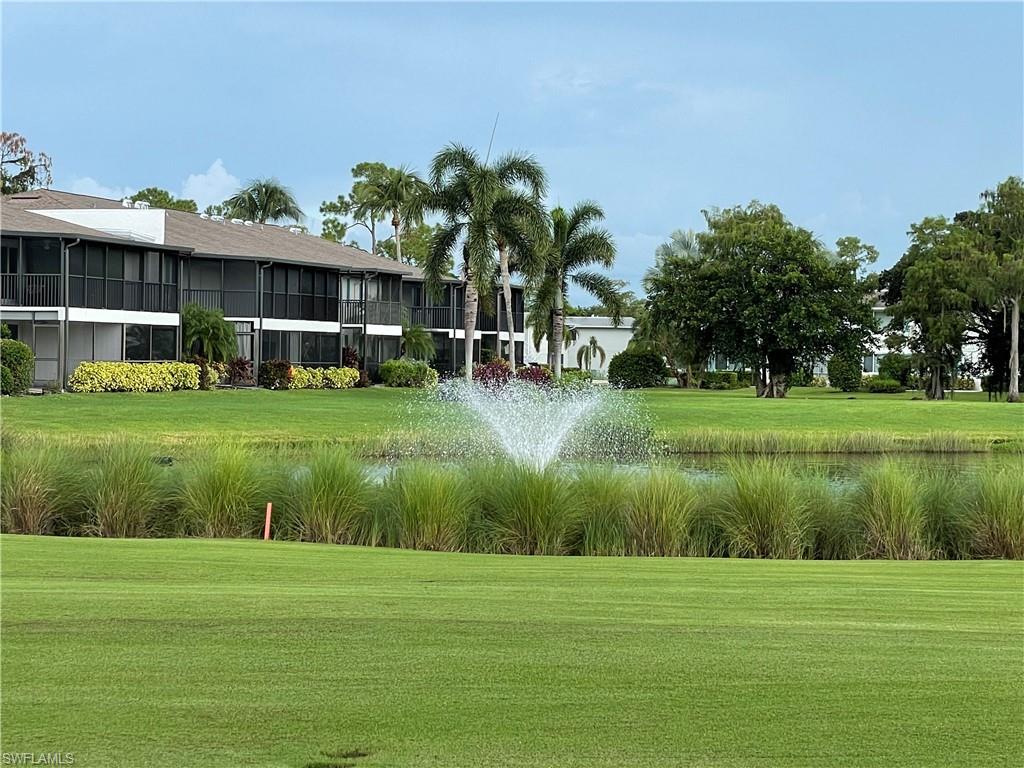 541 Teryl Road, Unit 1 Naples, FL 34112 - Photo 32 of 33 a view of a big yard with a house in the background