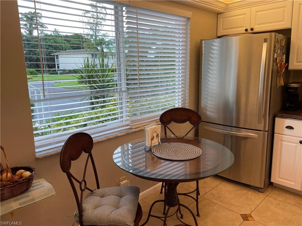 541 Teryl Road, Unit 1 Naples, FL 34112 - Photo 5 of 33 a dining room with furniture and a window