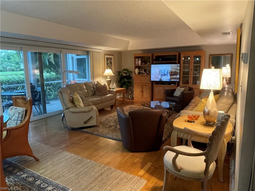 541 Teryl Road, Unit 1 Naples, FL 34112 - Photo 7 of 33 a living room with furniture and a window