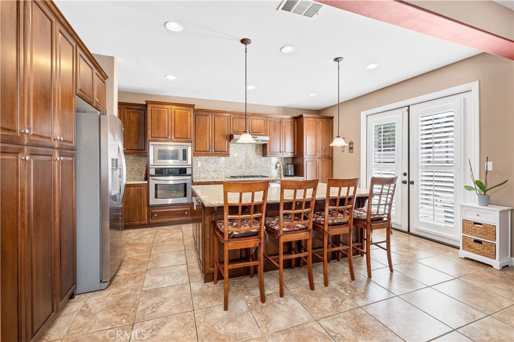 353 Caldera Street Perris, CA 92570 - Photo 18 of 53 a dining area with furniture and window