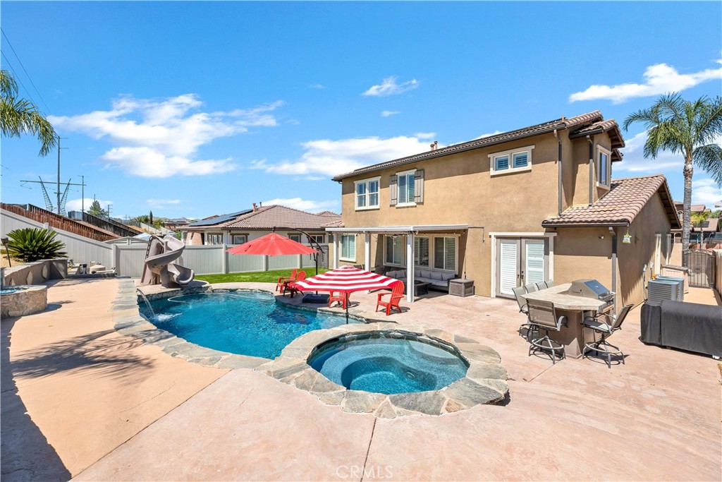 353 Caldera Street Perris, CA 92570 - Photo 2 of 53 a front view of house with yard outdoor seating and barbeque oven
