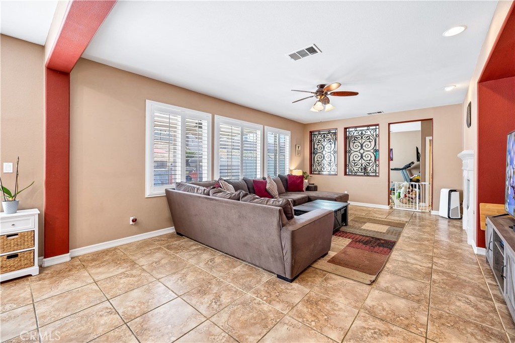 353 Caldera Street Perris, CA 92570 - Photo 23 of 53 a living room with furniture and a large window
