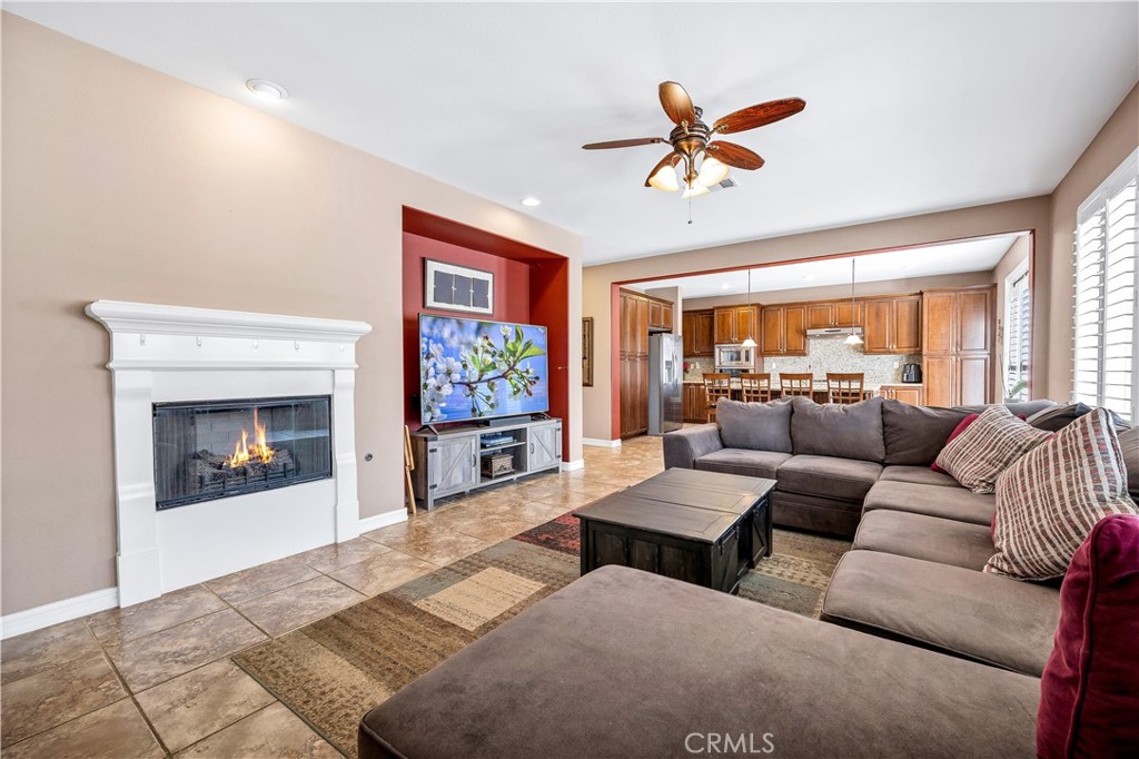 353 Caldera Street Perris, CA 92570 - Photo 26 of 53 a living room with furniture and a fireplace