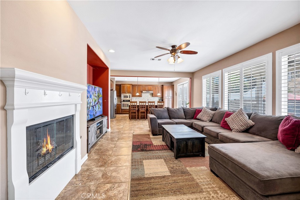 353 Caldera Street Perris, CA 92570 - Photo 27 of 53 a living room with furniture and a fireplace