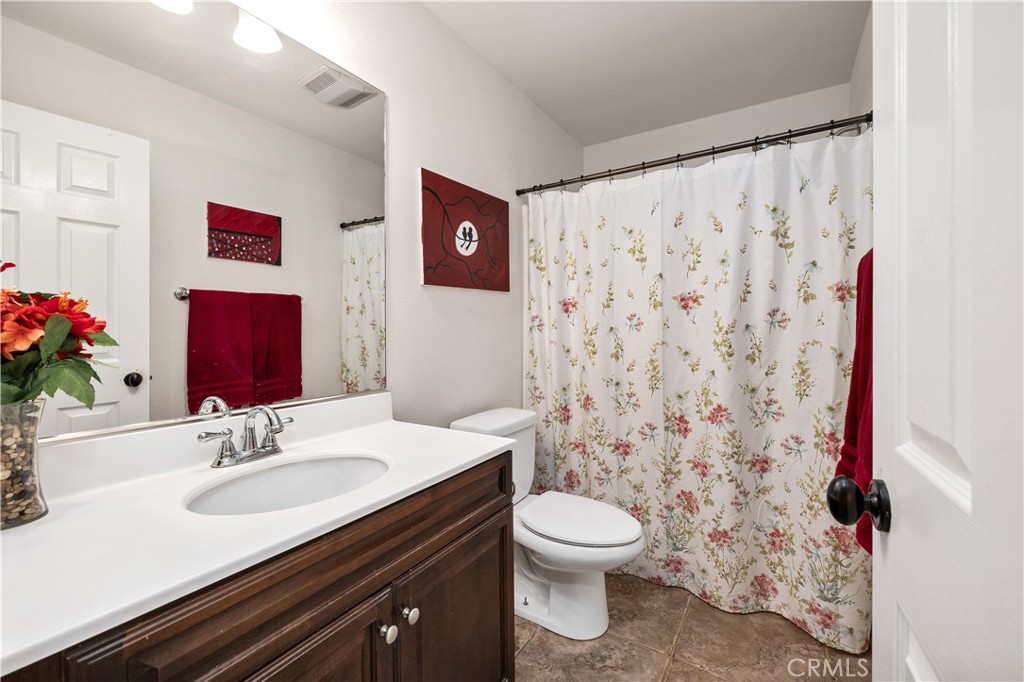 353 Caldera Street Perris, CA 92570 - Photo 30 of 53 a bathroom with a sink toilet and shower