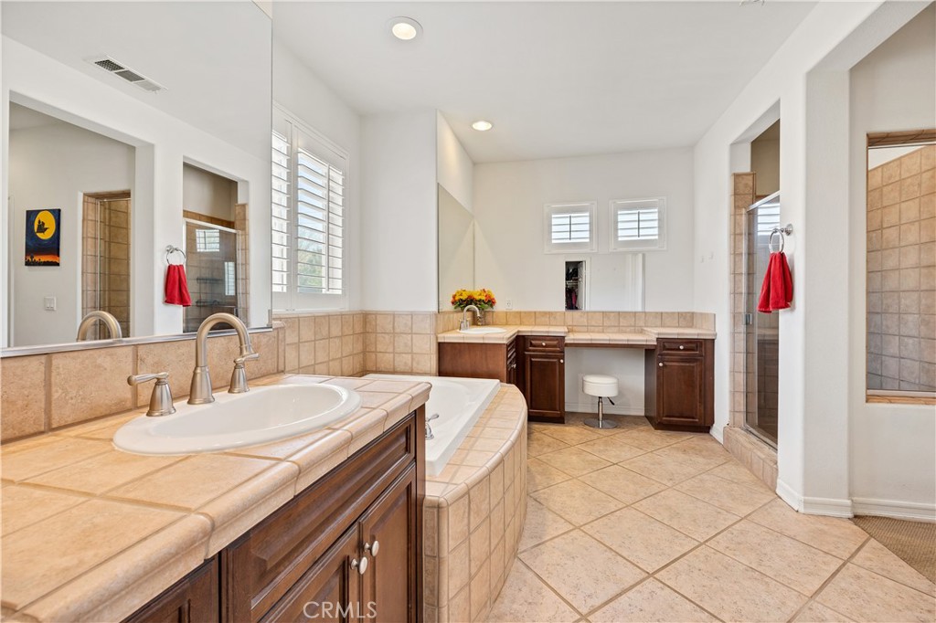 353 Caldera Street Perris, CA 92570 - Photo 38 of 53 a kitchen with a sink stove and cabinets