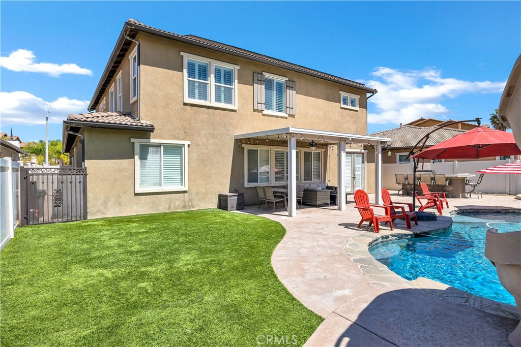353 Caldera Street Perris, CA 92570 - Photo 44 of 53 a view of a house with a yard porch and sitting area