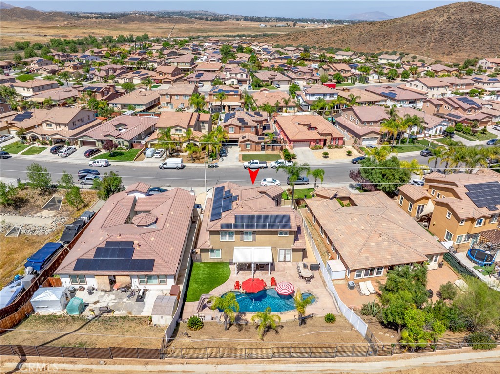 353 Caldera Street Perris, CA 92570 - Photo 51 of 53 an aerial view of residential houses with yard and ocean view