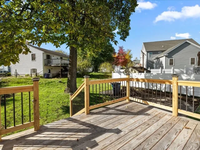 a balcony with view of trees in the background