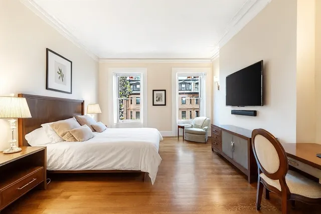a bathroom with a tub a sink and a window