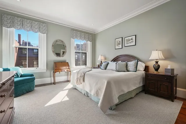 a bathroom with a sink vanity granite toilet and shower