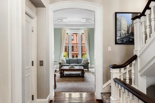a view of a livingroom with furniture and hardwood floor