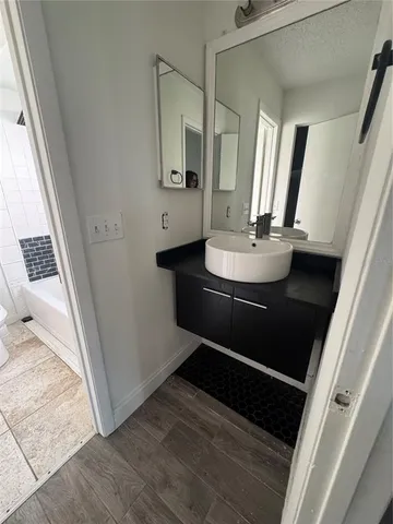 a bathroom with a sink and a mirror