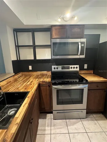 a kitchen with a stove and a microwave