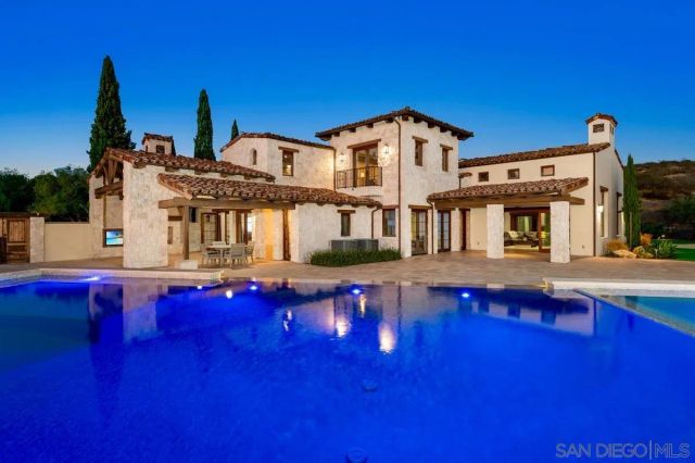 a front view of house with yard and patio
