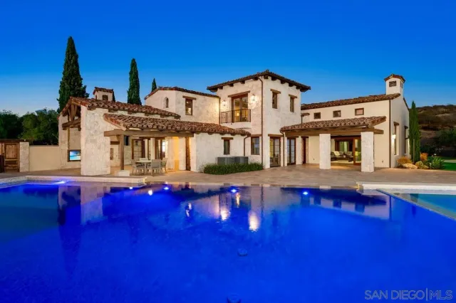 a front view of house with yard and patio