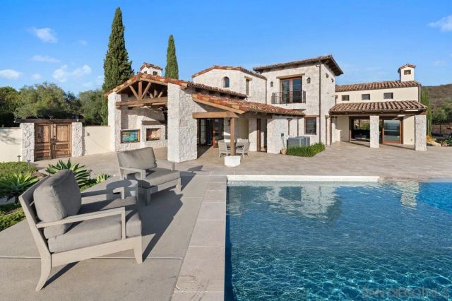 a terrace of a house with outdoor seating