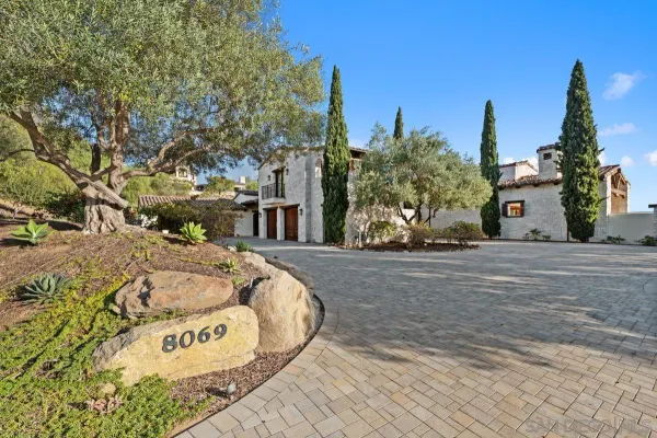 a view of a street with a building in the background