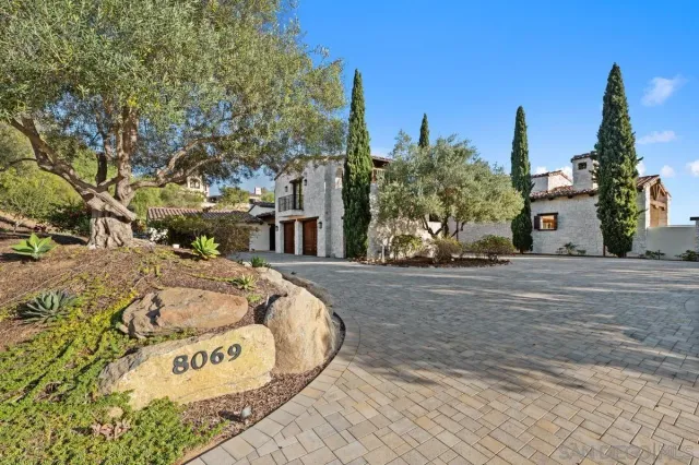 a view of a street with a building in the background