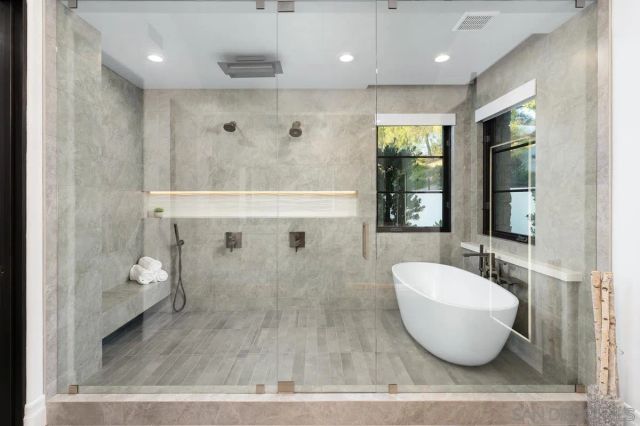 a living room with furniture a dining table and chairs with wooden floor